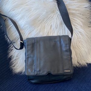 Tumi gently used black leather cross body bag - unisex